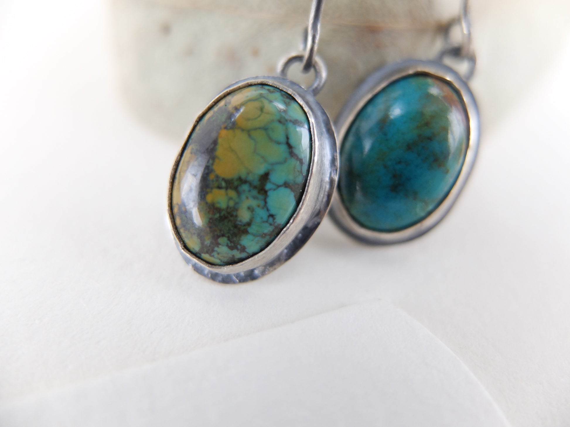 Turquoise stone earrings on a white background