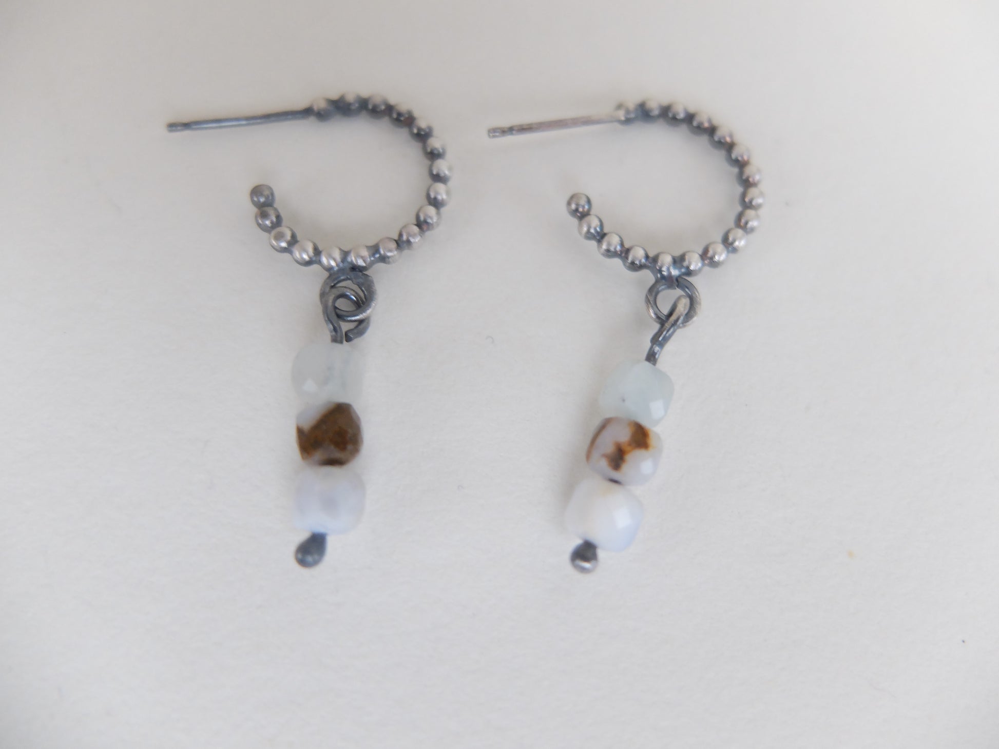Pair of beaded earrings on a light background