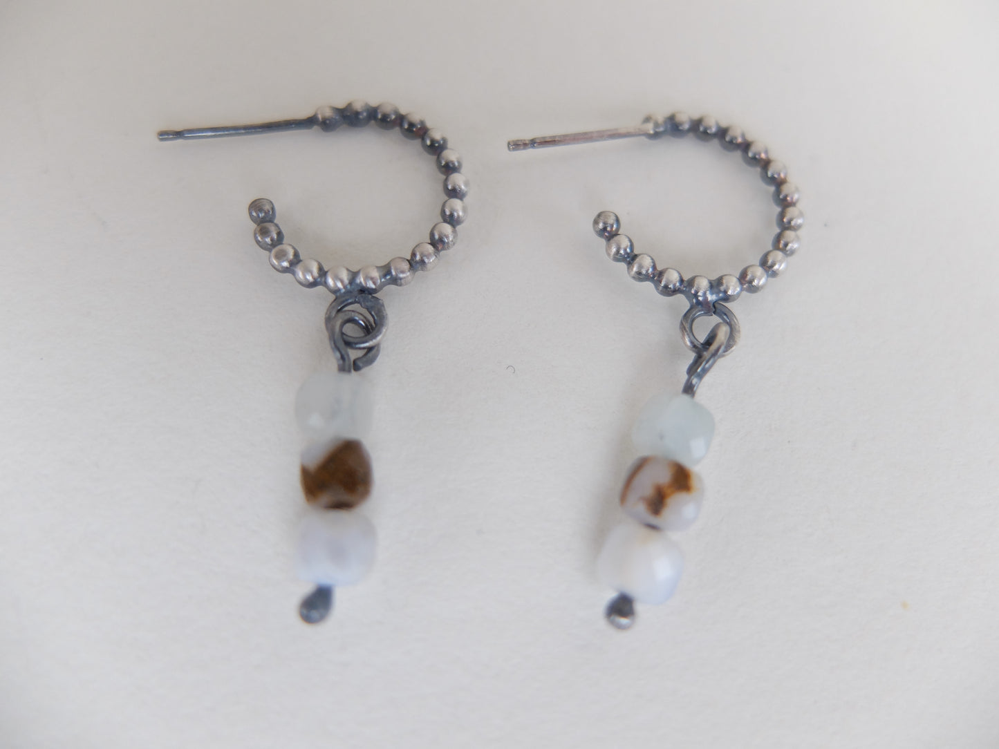 Pair of beaded earrings on a white background