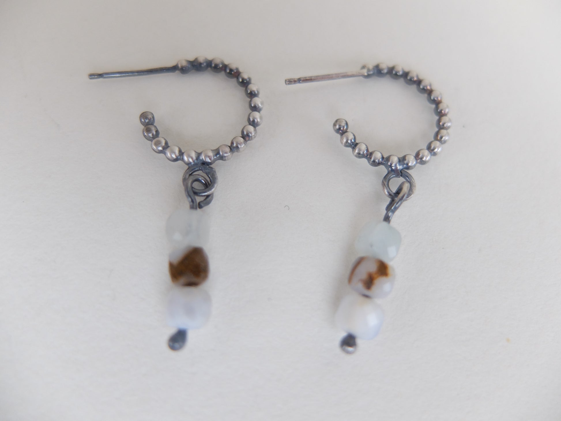 Pair of beaded earrings on a white background