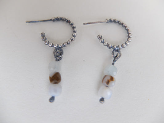 Pair of beaded earrings on a white background