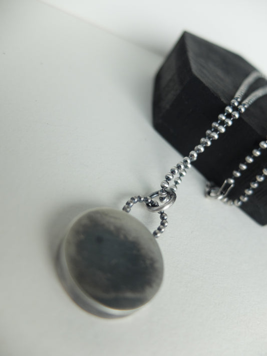 Necklace with a pendant on a white background