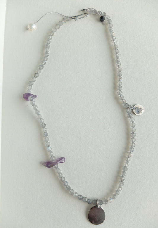 Labradorite Beaded necklace with purple Amethyst accents on a light grey background