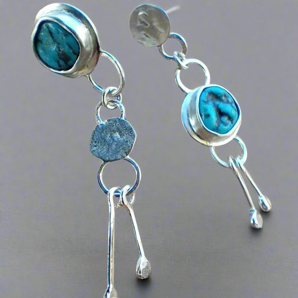 Delia asymmetric and mismatched silver earrings